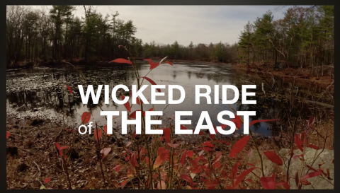 Photo of a pond in the fall with text overlay that reads "Wicked Ride The East."